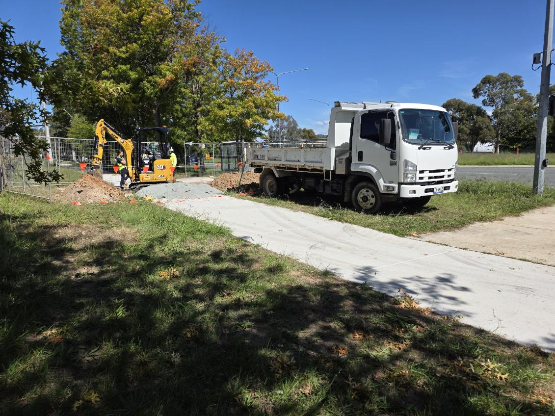 Ridgeway Civil truck and excavator working beside a fenced site